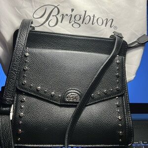Brighton black small crossbody purse with front flap with magnetic closure.